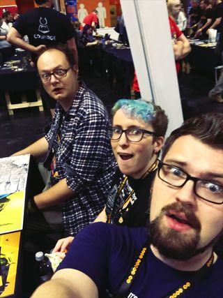 Chris, Mary, and Grant on their UK Games Expo table.