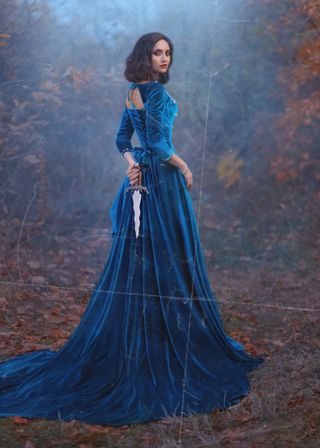 Beautiful woman in long blue dress